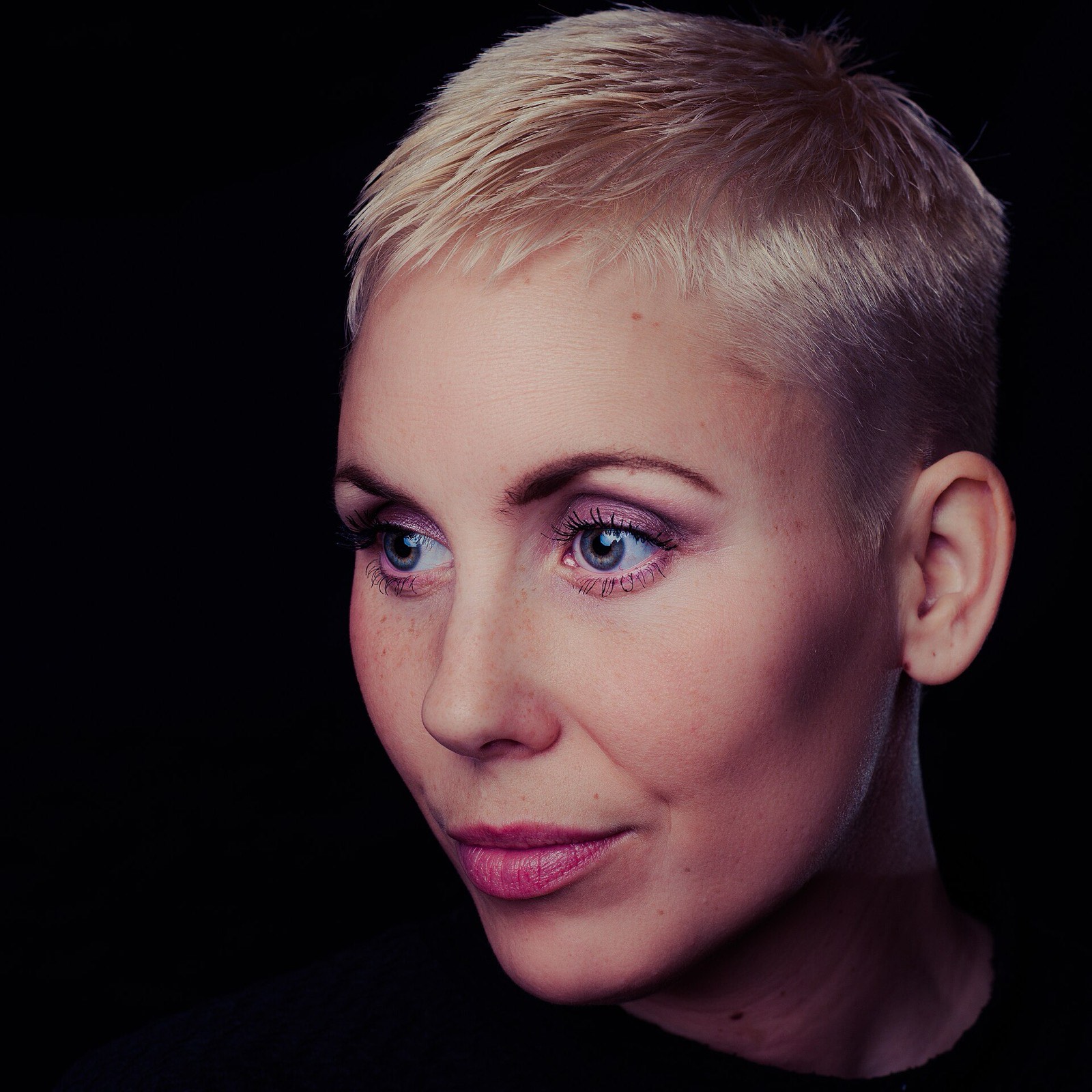 Pixie haircut with a clean line.