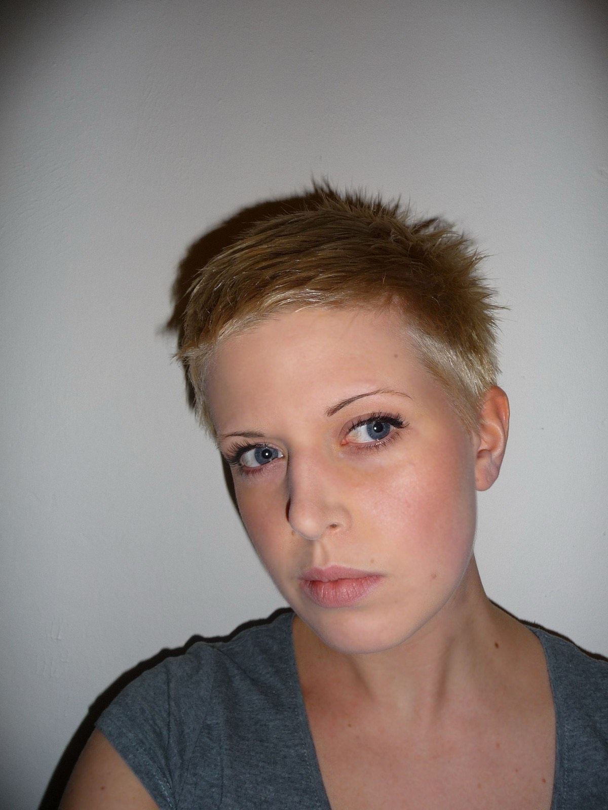 Platinum pixie cut with vivid colour.